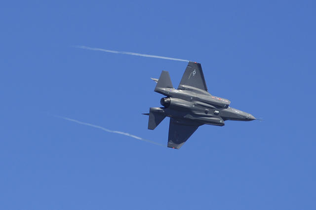 An F-35 Lightning II maneuvers during its first flight over Eglin Air Force Base, Fla., April 23, 2009. The jet is a fifth generation, single engine, stealth-capable strike fighter and can perform close air support, tactical bombing and air defense m...